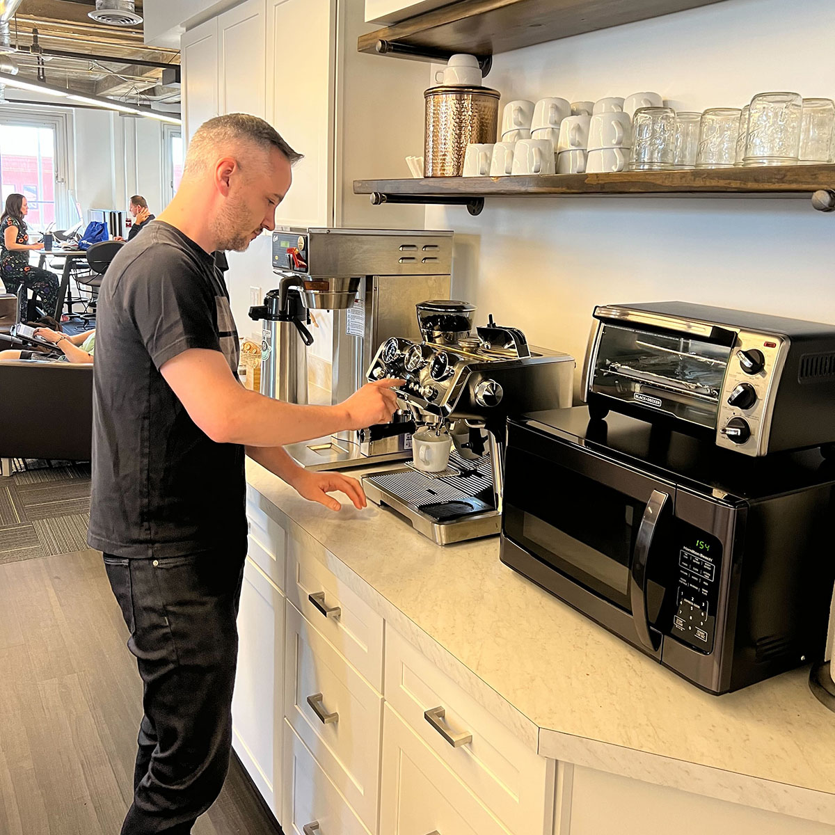 A member using the espresso machine in our community kitchen