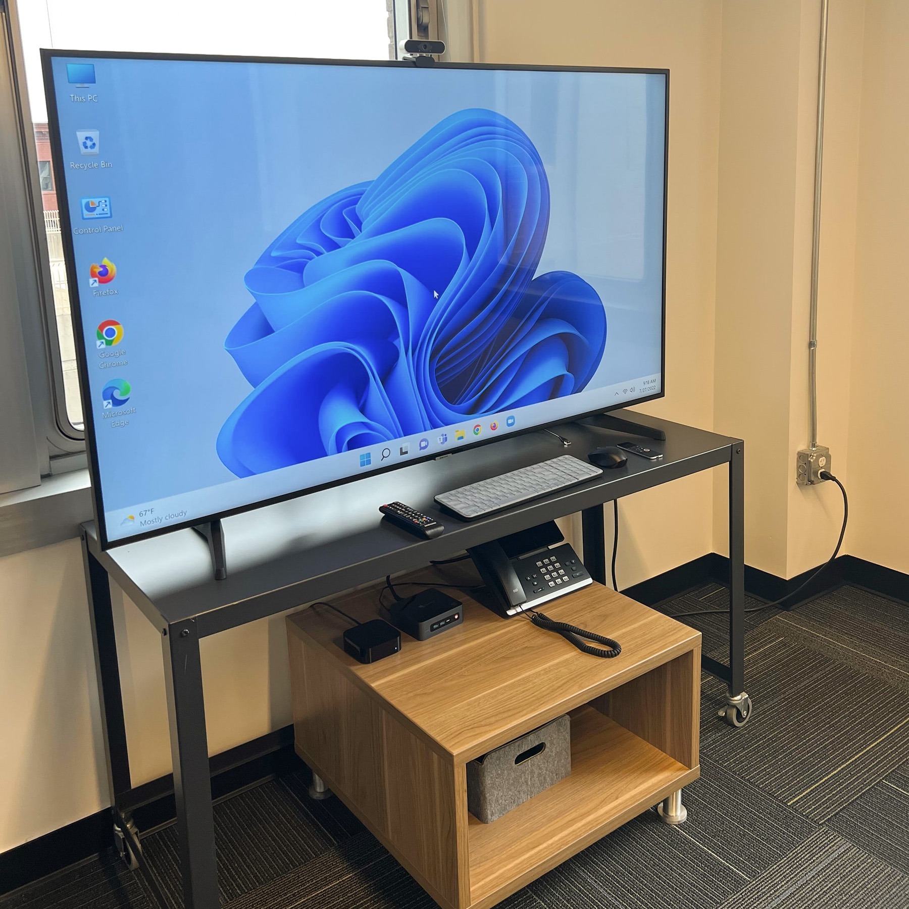 Large television with devices in the Learning Center conference room